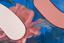 Lush stems of gorgeous coral-coloured roses play against a deep blue and white background. Image 8