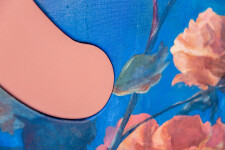 Lush stems of gorgeous coral-coloured roses play against a deep blue and white background. Image 15