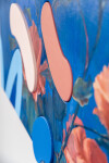 Lush stems of gorgeous coral-coloured roses play against a deep blue and white background. Image 12
