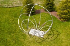 Canadian artist Jake Goertzen creates a symmetrical design with six stainless steel rings in this elegant outdoor sculpture. Image 7