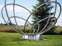 Canadian artist Jake Goertzen creates a symmetrical design with six stainless steel rings in this elegant outdoor sculpture. Image 4
