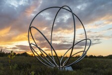 Canadian artist Jake Goertzen creates a symmetrical design with six stainless steel rings in this elegant outdoor sculpture. Image 9