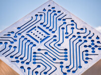 A stainless-steel cube is laser cut on three sides with the outline of a digital circuit board in this intriguing outdoor sculpture by Jake … Image 5