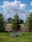 Canadian artist Jake Goertzen creates a symmetrical design with six stainless steel rings in this elegant outdoor sculpture. Image 2