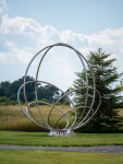 Canadian artist Jake Goertzen creates a symmetrical design with six stainless steel rings in this elegant outdoor sculpture. Image 5