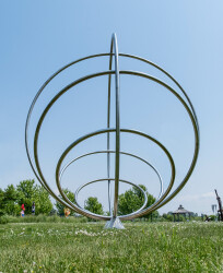 Canadian artist Jake Goertzen creates a symmetrical design with six stainless steel rings in this elegant outdoor sculpture.