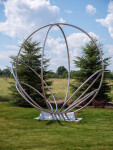 Canadian artist Jake Goertzen creates a symmetrical design with six stainless steel rings in this elegant outdoor sculpture. Image 3