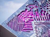 A stainless-steel cube is laser cut on three sides with the outline of a digital circuit board in this intriguing outdoor sculpture by Jake … Image 6