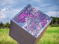 A stainless-steel cube is laser cut on three sides with the outline of a digital circuit board in this intriguing outdoor sculpture by Jake … Image 7