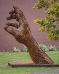 A massive hand appears to rise out of the earth in this engaging sculpture by Mississippi artist, Jason Kimes. Image 5