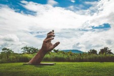 A massive hand appears to rise out of the earth in this engaging sculpture by Mississippi artist, Jason Kimes. Image 6