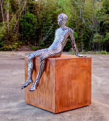 This large figurative contemporary metal sculpture is designed for the outdoors.