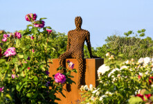 This figurative outdoor sculpture is forged from steel. Image 11