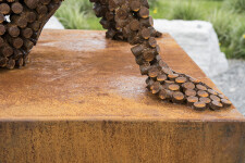 This figurative outdoor sculpture is forged from steel. Image 6