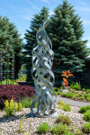 Jean-Marc Tétrault’s abstract sculptures can be found in many public venues including his own township in Quebec where he created a steel sc… Image 4