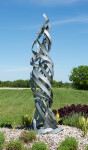Jean-Marc Tétrault’s abstract sculptures can be found in many public venues including his own township in Quebec where he created a steel sc… Image 2
