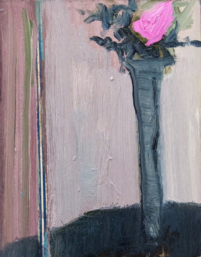 A tall vase with a single rose in bright 