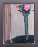 A tall vase with a single rose in bright 