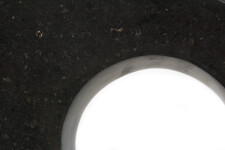 Smooth-surfaced, black granite has been engineered into an elegant figure eight shape by sculptor Jeremy Guy. Image 3