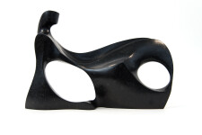 This abstract figurative sculpture is made of engineered black granite by Jeremy Guy. Image 6