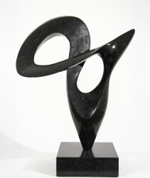 Smooth-surfaced, engineered black granite is sculpted into an elegant, spinning form by Jeremy Guy.