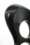 Smooth-surfaced, black granite has been engineered into an elegant figure eight shape by sculptor Jeremy Guy. Image 6