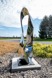 Jeremy Guy’s large contemporary outdoor sculpture called ‘Mobius’ is hand-forged from stainless steel; its abstract form is based on a mathe…