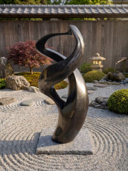 This contemporary abstract black stone sculpture is by Jeremy Guy.