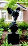 Smooth surfaced, black granite has been engineered and sculpted into an elegant and classic depiction of a human figure by Jeremy Guy. Image 2