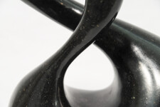 With its fluid and elegant lines, this abstract stone sculpture by Jeremy Guy appears to resemble a figure eight. Image 6