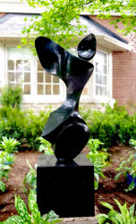 Smooth-surfaced, black granite has been engineered and sculpted into an elegant and classic depiction of a human figure by Jeremy Guy.