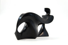 This abstract figurative sculpture is made of engineered black granite by Jeremy Guy. Image 4