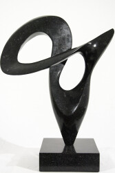 Smooth-surfaced, engineered black granite is sculpted into an elegant, spinning form by Jeremy Guy.