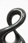 With its fluid and elegant lines, this abstract stone sculpture by Jeremy Guy appears to resemble a figure eight. Image 9