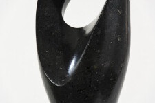 Smooth-surfaced, engineered black granite is sculpted into an elegant, spinning form by Jeremy Guy. Image 3