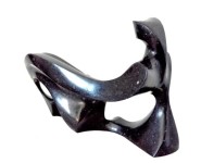 Smooth surfaced, black granite has been engineered intio an elegant and classic depiction of a reclining figure by Jeremy Guy. Image 2