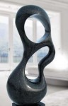 Smooth surfaced, black granite has been engineered into an elegant organic shape by sculptor Jeremy Guy. Image 4