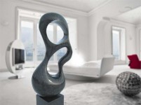 Smooth surfaced, black granite has been engineered into an elegant organic shape by sculptor Jeremy Guy. Image 5