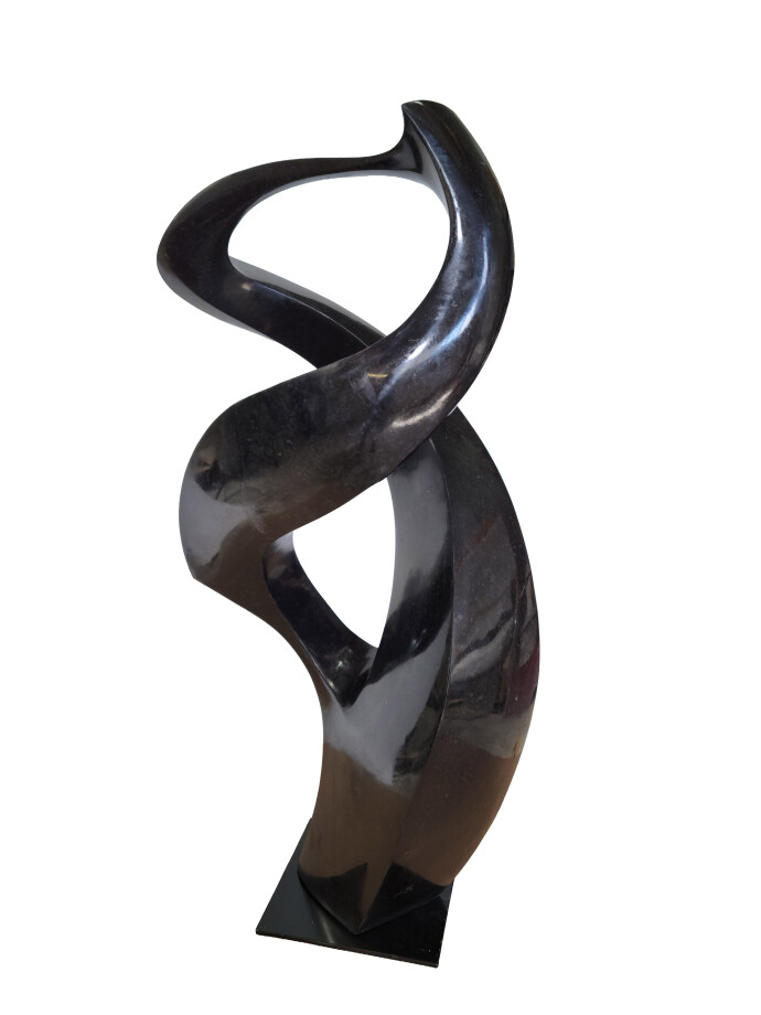This contemporary abstract black stone sculpture is by Jeremy Guy.