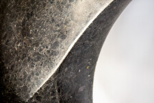 Smooth-surfaced, black granite flecked almost imperceptibly with copper and white has been engineered into an elegant ribbon in tangible con… Image 8