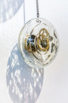Four elegant blown glass orbs that contain assembled clock works hang from fine chain in this unique wall sculpture by John Paul Robinson.Th… Image 4