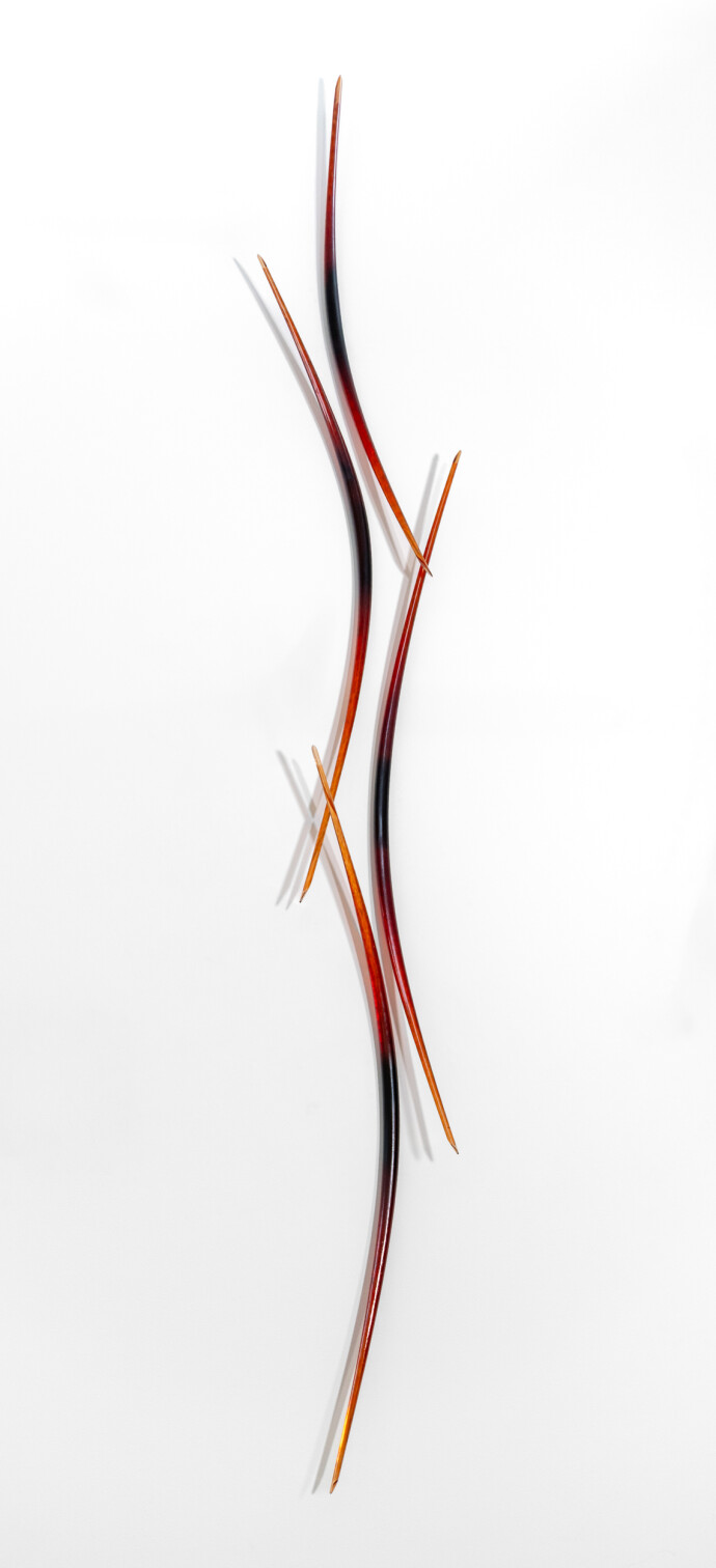 This red and orange glass wall sculpture is by John Paul Robinson.