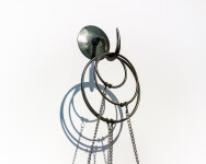 Four elegant blown glass orbs that contain assembled clock works hang from fine chain in this unique wall sculpture by John Paul Robinson.Th… Image 8