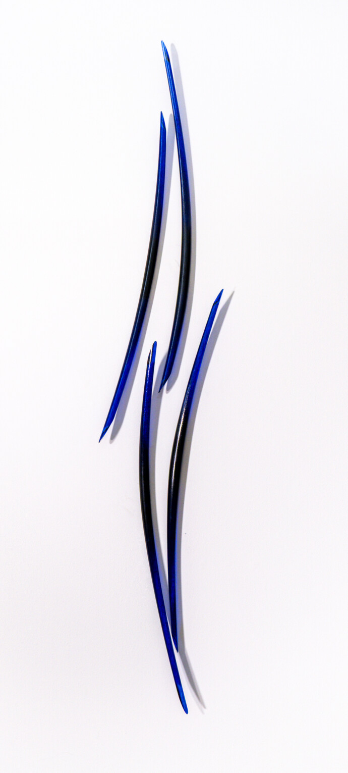 This blue glass wall sculpture is by John Paul Robinson.