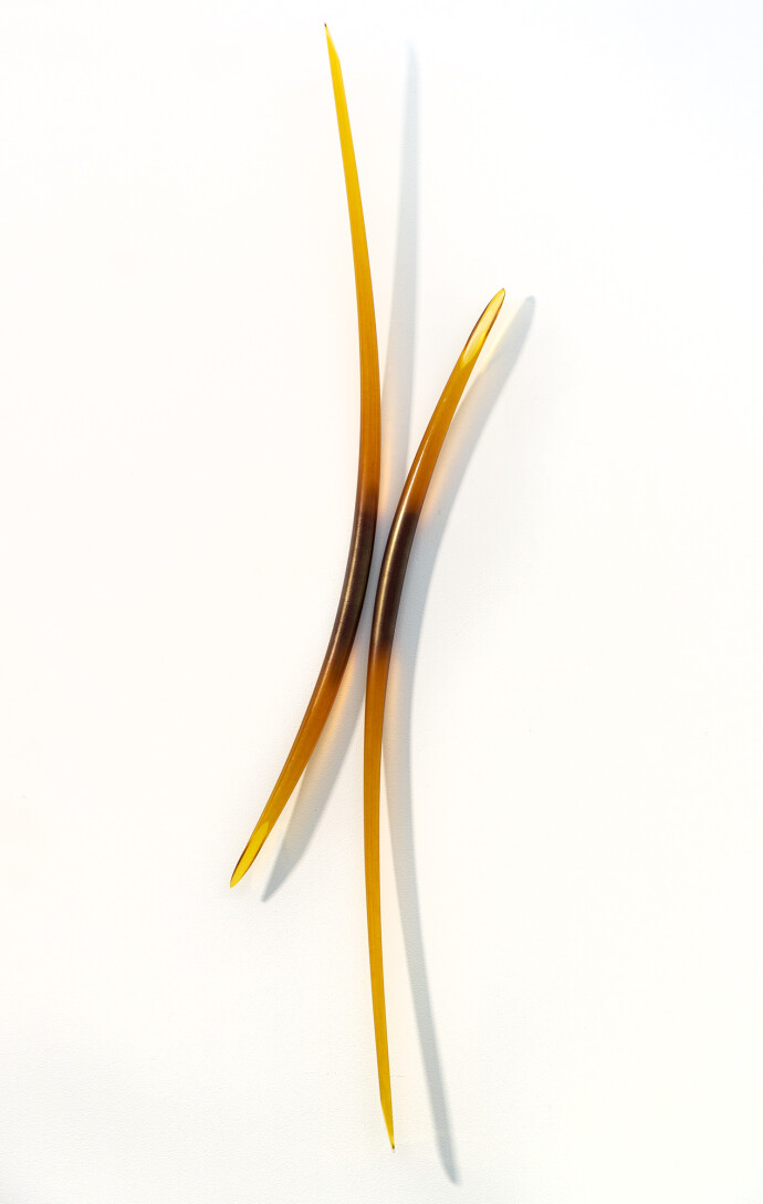 This amber glass wall sculpture is by John Paul Robinson.