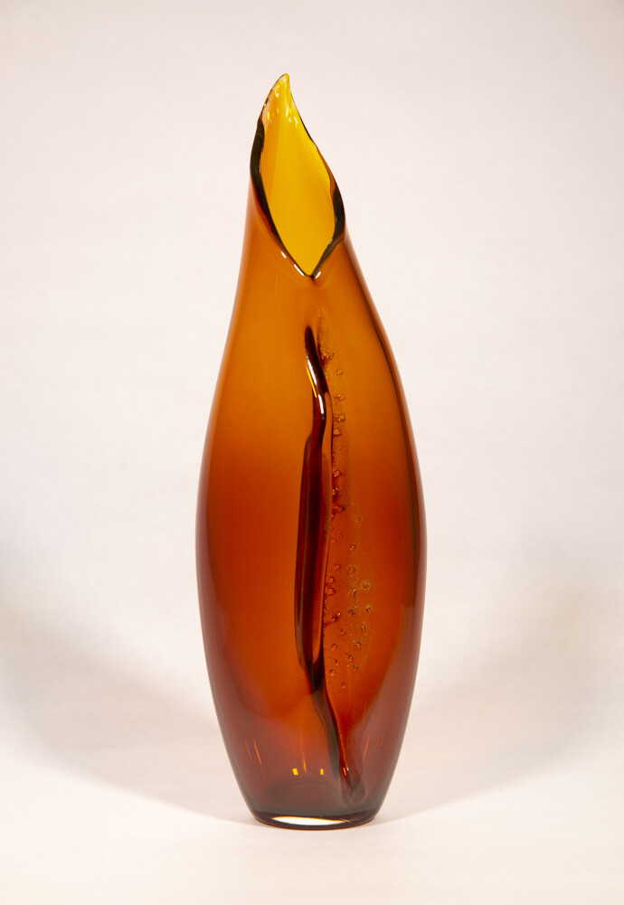 This modern glass amber vase by Julia Reimer is inspired by nature.