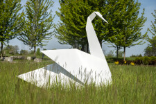 This contemporary metal garden sculpture is made in the form of a white swan. Image 2