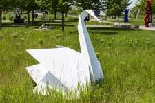 This contemporary metal garden sculpture is made in the form of a white swan. Image 9