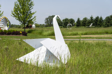 This contemporary metal garden sculpture is made in the form of a white swan. Image 6