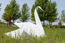 This contemporary metal garden sculpture is made in the form of a white swan. Image 7